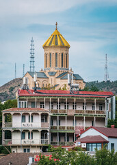 Wall Mural - View on the Sameba cathedral and its golden dome from the Narikala fortress in old Tbilisi (Georgia)