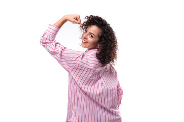 Wall Mural - young authentic slim curly brunette model woman wearing pink striped shirt