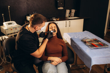 Wall Mural - Woman meeting with plastic surgeon before operation in clinic