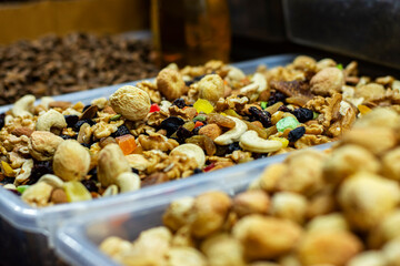 A seller selling delicious Afghan dry fruits snacks items at Industrial trade fair in Kolkata, West Bengal, India.