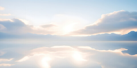 Wall Mural - beautiful light blue clouds and mountains reflected in the water at dawn. natural background.