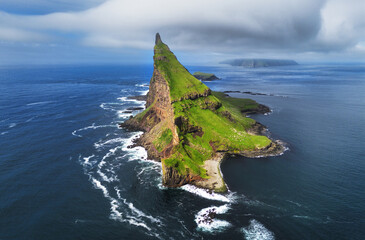 Wall Mural - Tindholmur on Faroe Islands Vagar, aerial drone view during day in North Atlantic Ocean. Faroe Islands, Denmark, Europe.