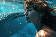 close up view of a beautiful girl in swimsuit swimming under water in the ocean with whale shark