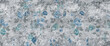 © Vidal - blue flowers pattern with cement texture background