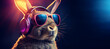 Rabbit in glasses plunged into the music. Rabbit listen to tunes in headphones with copy space