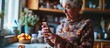 Senior woman uses smartphone to check recipe while holding a pill.