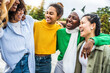© Davide Angelini - Multi ethnic group of young women hugging outside - Happy girlsfriends having fun laughing out loud on city street - Female community concept with cheerful girls standing together - Women  power