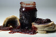 Spoiled jam with moldy pieces of bread