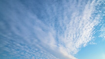 Blue sky white clouds. Puffy fluffy white clouds. Cumulus cloud cloudscape timelapse. Summer blue sky time lapse. Nature weather blue sky. White clouds background.