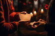 A close-up photo of hands exchanging a love letter under soft candlelight
