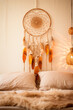 Boho style bedroom with dream catcher. Selective focus.