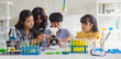 © lovelyday12 - Group of school children using microscopes to study science at school