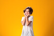 © Aleksej - Smiling kid girl over yellow background. Emotion concept