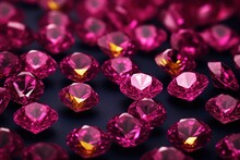  A Group Of Pink Diamonds Sitting On Top Of A Black Surface With Lots Of Pink Diamonds In The Middle Of The Image.