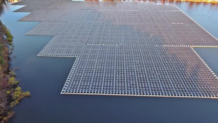 Wall Mural - Solar panels float on surface of lake during environmentally friendly generation of electricity