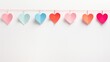 Hanging heart on rope. Colorful hanging heart on white background.