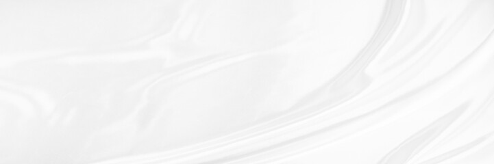 White gray satin texture that is white silver fabric silk panorama background with beautiful soft blur pattern natural.