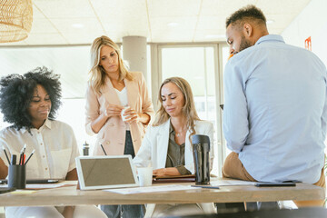 Business team sharing ideas for a startup project while working together in the office.