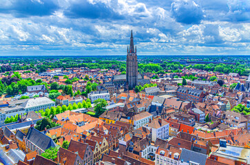 Bruges cityscape, aerial panoramic view of Bruges historical city centre, old buildings, Church of Our Lady, skyline horizon, panorama of Brugge old town quarter district, Flemish region, Belgium