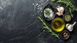 Olive Oil, Rosemary, Salt, Garlic, Pepper on Black Table

