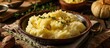 Thanksgiving mashed potatoes made at home with butter and thyme.