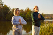 © Studio Romantic - Active senior couple doing yoga exercises in nature. Elderly man and woman in sportswear having sport workout in the park. Outdoors training, healthy lifestyle and fitness for retired people concept.