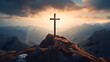 Wooden cross silhouette on rocky mountain top or peak, sunrise on the sky. Christian faith or religion, crucifixion of Jesus Christ, Calvary sacrifice for salvation and forgiveness