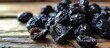 © The 2R Artificiality - Sweet pitted prunes drying on the kitchen table.