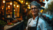 © Keitma - Adult woman chef de cuisine, standing in front of her restaurant
