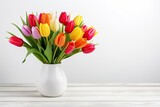 Fototapeta Tulipany - Bouquet of colorful tulips in vase on wooden background
