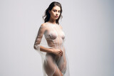 Veiled nude woman exuding sensuality through transparency