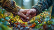 Hands of an old man in the autumn forest. Selective focus.