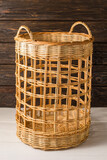 Fototapeta  - Tall wicker basket with two handles