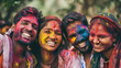 copy space, stockphoto, candid photo of a Group of smiling indian man and woman portrait, colored smiling indian faces with vibrant colors during the celebration of the holi festival in India. Group o