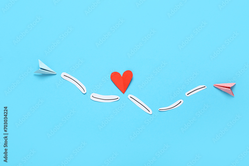 Composition with paper decor on color background for Valentine's Day celebration