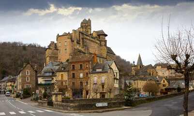 Wall Mural - Day view of stone houses of medieval town Estaing in France