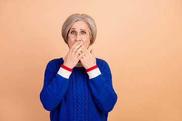 Sticker - Portrait of frightened senior woman wear blue jumper in eyewear palms cover mouth astonished staring isolated on pastel color background