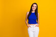 Photo of shiny cheerful woman wear blue top smiling empty space isolated yellow color background