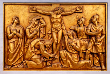 Wall Mural - The Crucifixion and Death of Jesus – Fifth Sorrowful Mystery. A relief sculpture in the Basilica of Our Lady of the Rosary of Fatima. 10 Aug 2023.