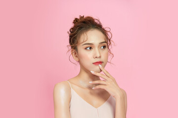 Canvas Print - Casual beauty concept of pretty Asian girl on pink background