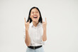 © Illhamt - An Asian woman in a white blouse flashes the 'rock on' hand sign while laughing openly. The white background highlights her energetic and expressive personality.