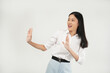 © Illhamt - An Asian woman in a white blouse gestures 'stop' with both hands and a playful smile. She combines confidence and humor against a clean white background.