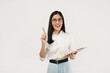 © Illhamt - An Asian woman wearing glasses looks inquisitively at the camera while holding a pen. She is in a white shirt, set against a plain studio backdrop.