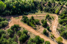 Top view of an impromptu motorcycle track on an old sand quarry