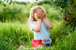 © Irina Schmidt - Little preschool girl picking fresh berries on blueberry field. Toddler child pick blue berry on organic orchard farm. Toddler farming. Preschooler gardening. Summer family fun. Healthy bio food.
