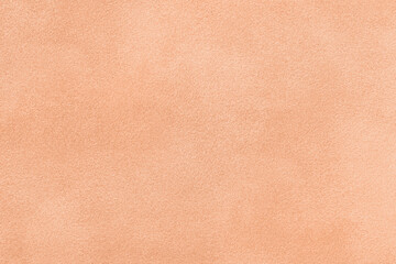 Sticker - Color of year 2024 peach fuzz. Light coral matte background of suede fabric. Velvet texture of textile,