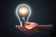 © drimerz - glowing light bulb in hand. bright idea concept