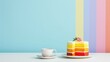 Multicolored rainbow Cake with empty place for text. LGBT Round sweets decorated flowers on plate with copy space. Happy pride month and Birthday. Minimalist food concept with tea and pastry.