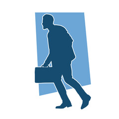 Silhouette of a business man carrying a briefcase