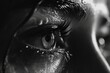 Close-up black and white photo of a woman's eye. Suitable for use in beauty, fashion, or conceptual projects